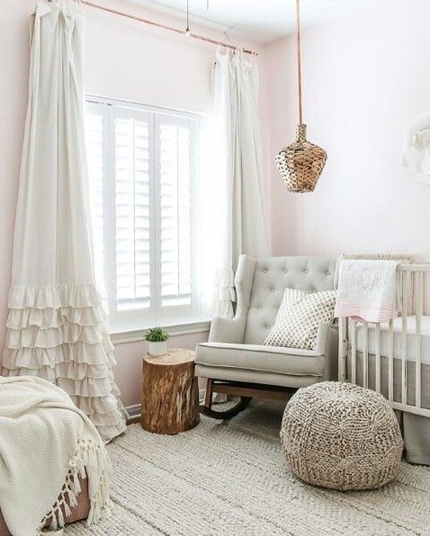 a neutral nursery featuring wicker accents and knit and crochet elements for more coziness