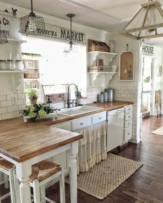 A Rustic Shabby Chic Kitchen With A Ruffled Curtain On A Cabinet Metal And Wooden Pendant Lamps And Green Blooms 