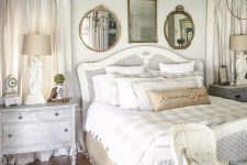 a shabby chic bedroom in neutrals, with refined furniture, touches of burlap, mirrors and pastel blue elements