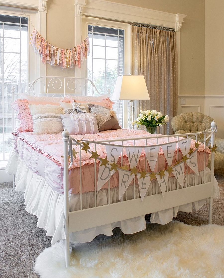 a shabby chic kid's bedroom with tan walls, vintage furniture, pink and white bedding, garlands and bannets and sparkling curtains