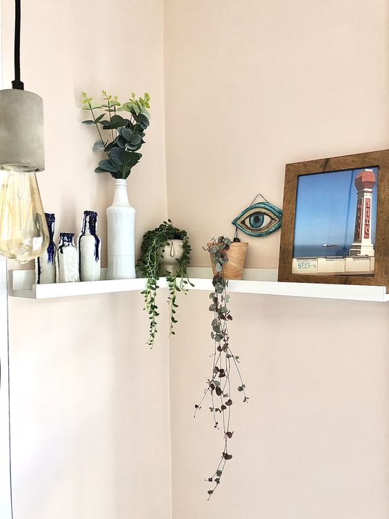 a simple ledge from IKEA can become a nice mini shelf with vases, potted plants and artworks and will fit many rooms