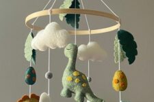 a super creative and fun dinosaur mobile with clouds, eggs, mountains and leaves is a colorful and vivacious idea