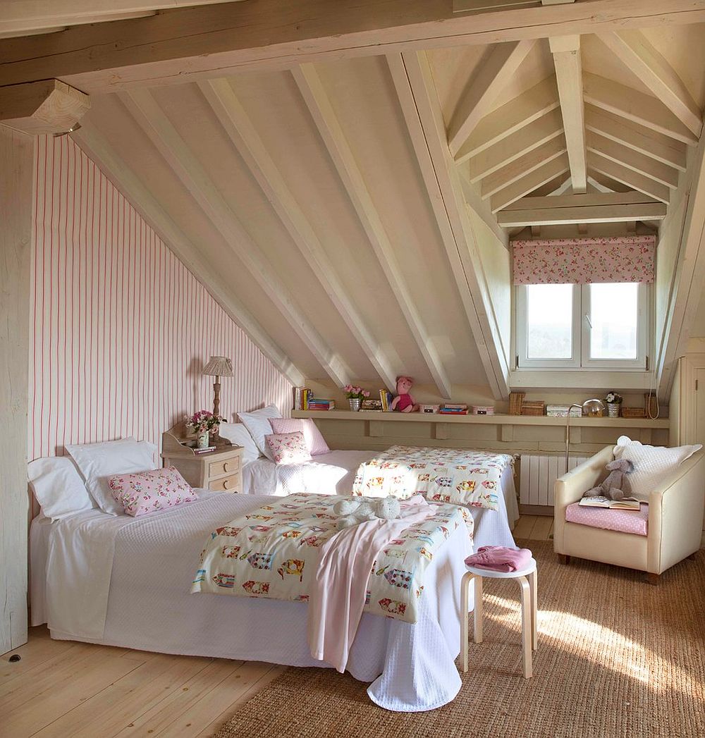 an attic shared shabby chic kids' room with a pink striped wall, neutral furniture, pink floral textiles and a curtain is very cozy