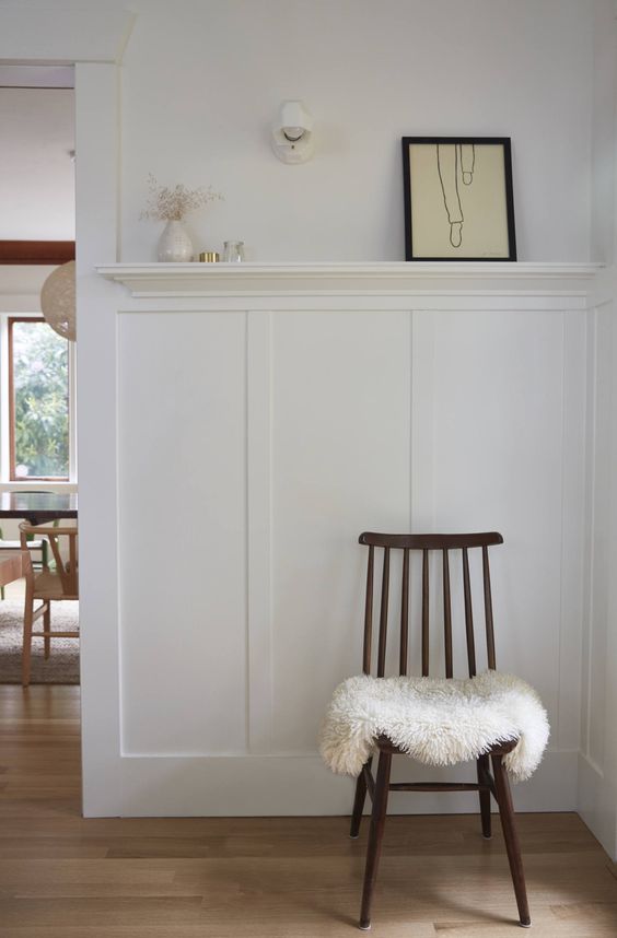 an awkward nook accented with a vintage ledge that allows displaying artworks, candles and other stuff there