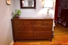 Sanding and staining the dresser can make it look more traditional.