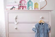 Flowers makes the dresser a perfect fit for a little girl’s room.