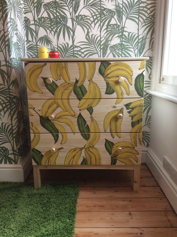 IKEA Tarva hack with painted bananas andgold knobs is a playful and whimsy item for storage
