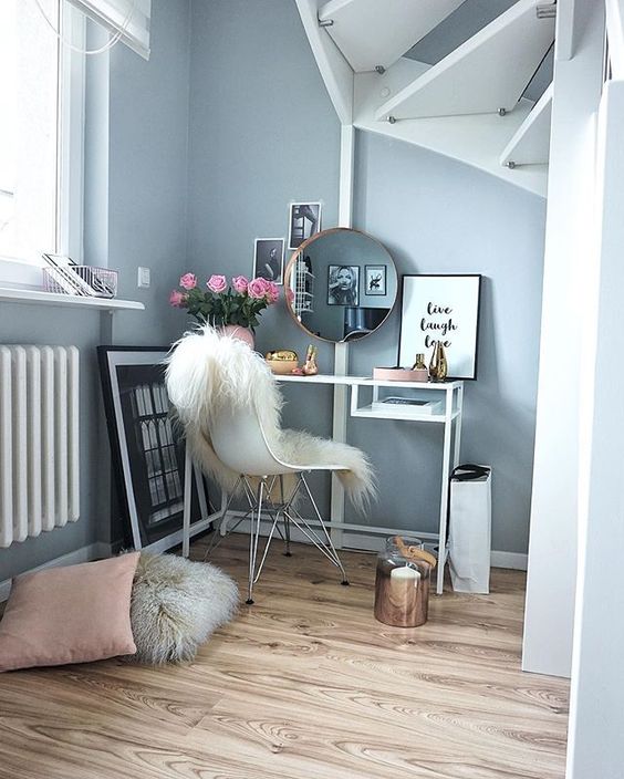 a Vittsjo vanity and a faux fur throw on your chair are all you need for a cool makeup nook, just add a bit of blooms