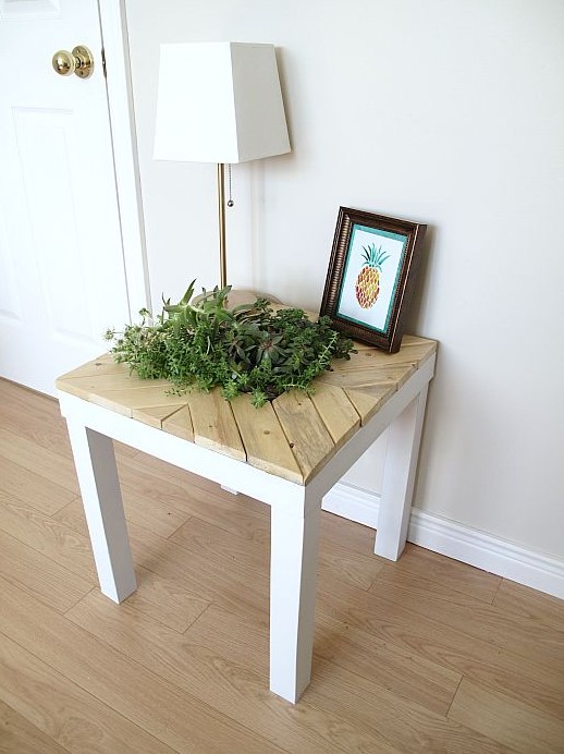 a chic farmhouse Lack table hack with light-colored wood and a planter right in the center