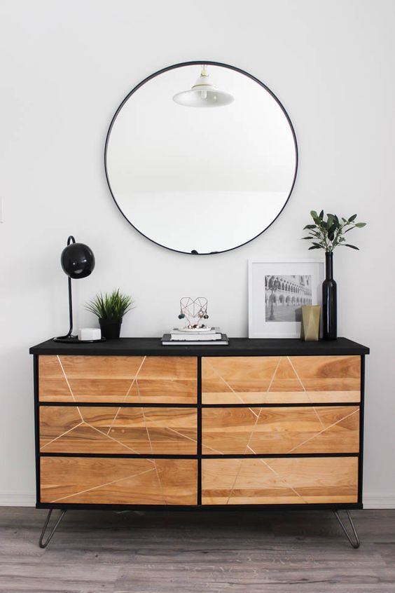 a contemporary Tarva hack with black paint, light-colored stain, a geometric pattern and hairpin legs