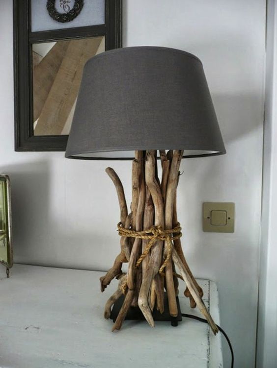 a cool and simple table lamp with a base covered with driftwood and a black lampshade is a lovely idea for a modern interior