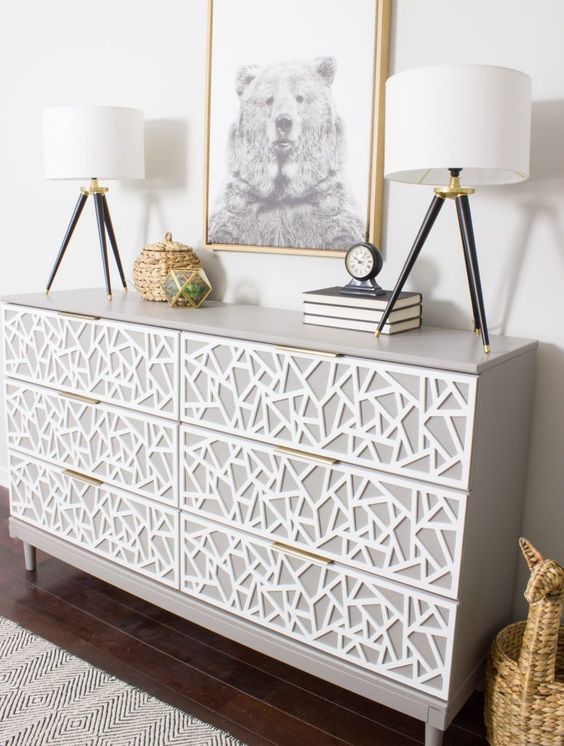 a creative Tarva dresser hack in dove grey, with white geometric inlays and tiny brass pulls