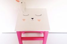 a cute IKEA Oddvar stool hacked with bright pink paint and a cute bunny face on top for a kids’ room