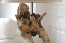a lovely driftwood table lamp of a cool piece of driftwood and a neutral lampshade is a stylish solution to go for