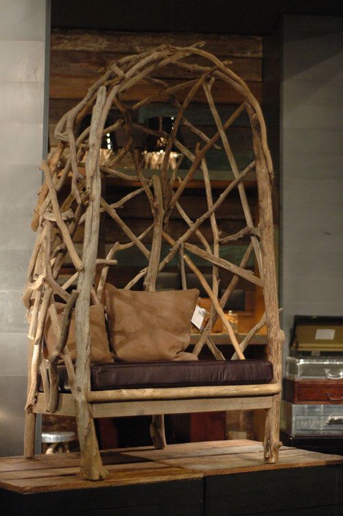 a trendy chair with a back madde of driftwood is a cool way to get a very edgy piece and reuse some materials at the same time