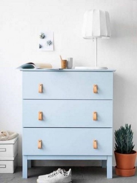 a trendy powder blue Tarva dresser with leather handles is a chic idea for a boho or contemporary space