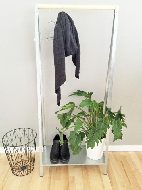 an IKEA Hyllis hack into a simple and minimal entryway rack for hanging clothes and storing shoes