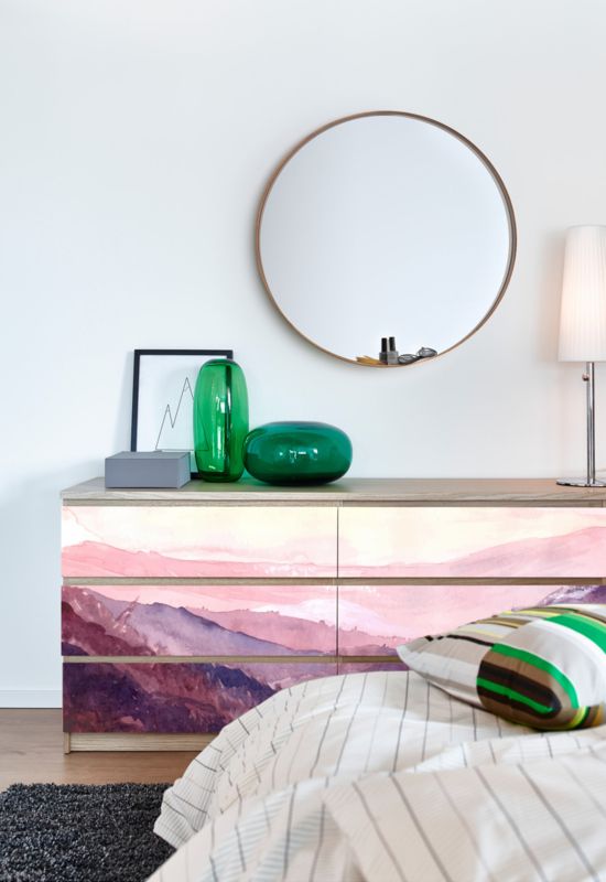 an IKEA Malm dresser with pink landscape decals is a cool and bold piece for a contemporary space