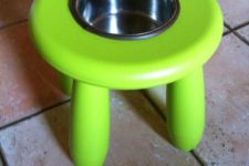 an IKEA Mammut stool repurporsed as a dog bowl stand is a cool and simple idea to add a bit more comfort to your pets’ space
