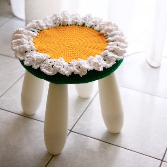 dress up an IKEA Mammut stool with a bright crochet cover that imitates a flower for a bold look