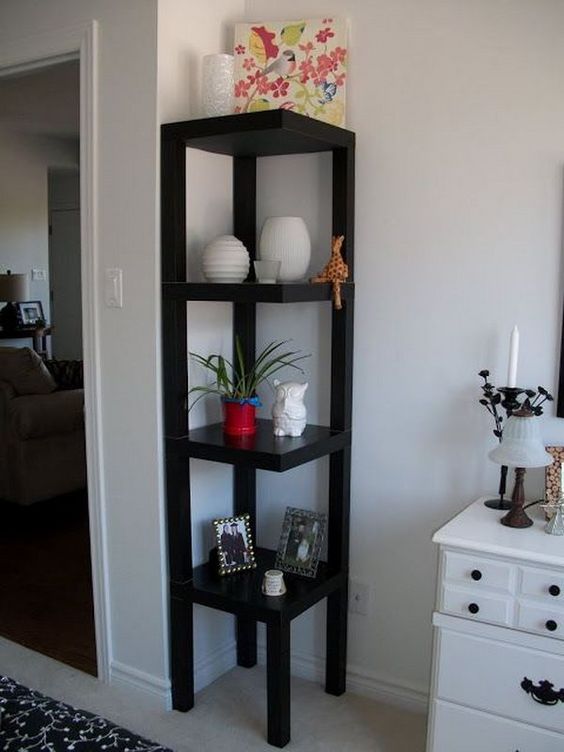 several black IKEA Lack tables designed into a single corner etagere will help you display and accommodate a lot of stuff