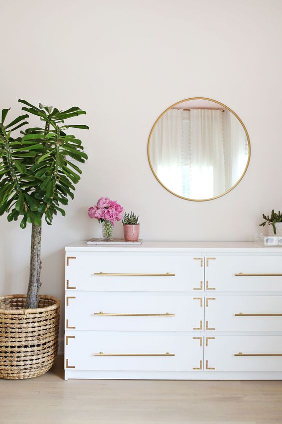 ultimate glam with a white Malm dresser accessorized with gold handles and gold corners