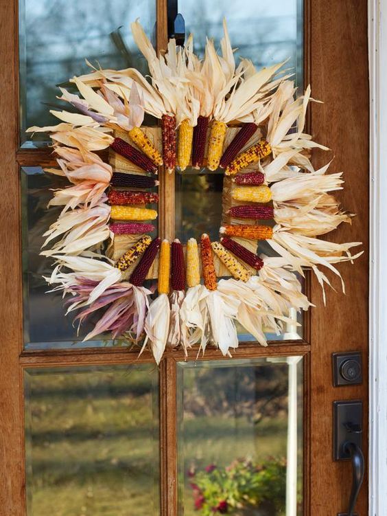 a bold fall wreath with a square form covered with corn knobs and corn husks is a lovely idea with a creative shape