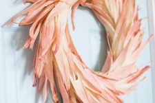 a bright dyed corn husk wreath will give an elegant touch of fall color to your outdoor space