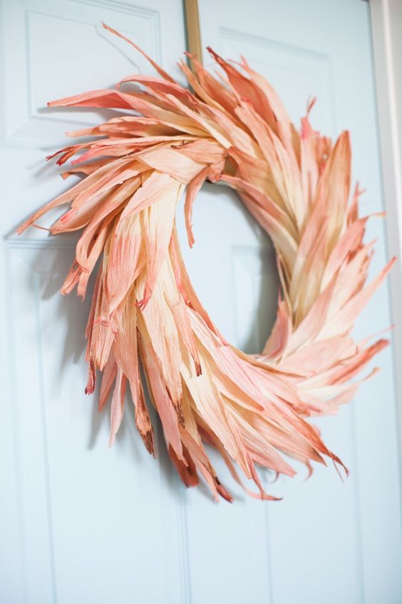a bright dyed corn husk wreath will give an elegant touch of fall color to your outdoor space