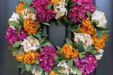 a colorful fall wreath for a front door