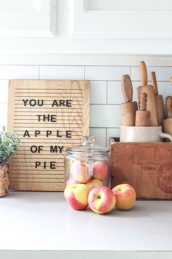 a contemporary fall sign of a light-stained wooden piece and black letters for a fall kitchen
