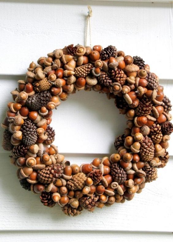 a cool natural fall wreath of acorns, nuts and pinecones is a timeless and long-lasting idea to try