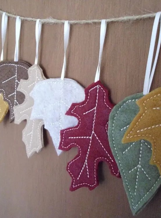 a cute and lovely colorful fall leaf banner with white stitching is a lovely idea for fall and Thanksgiving