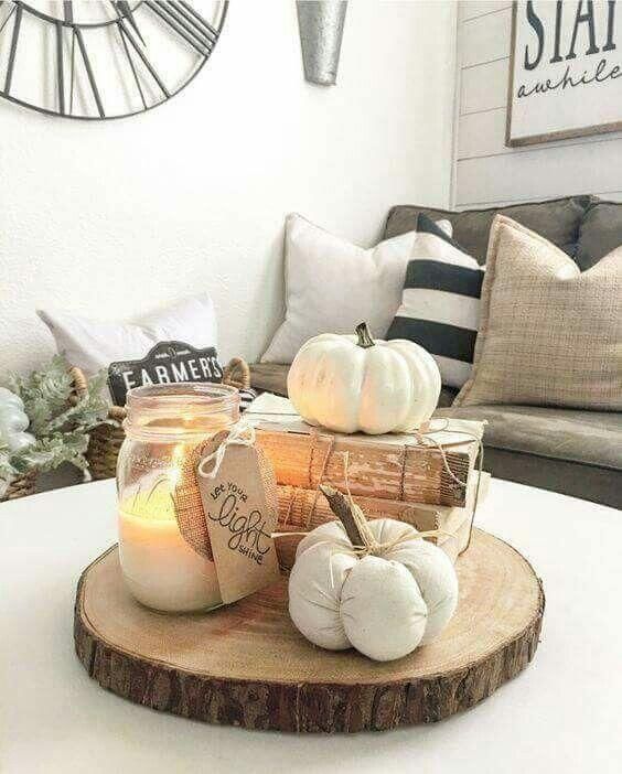 افكار لتنسيق الشموع في المنزل في فصل الخريف حصري 2020 A-fall-arrangement-of-a-wood-slice-vintage-books-faux-pumpkins-and-a-candle-in-a-jar-is-very-easy-and-cool