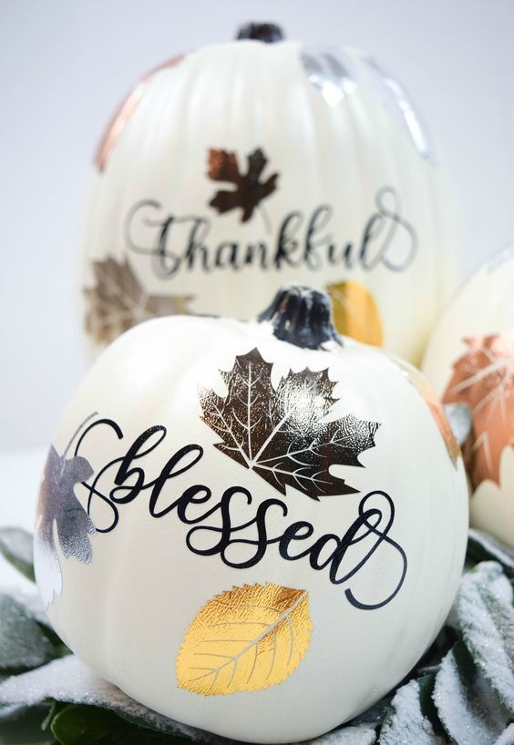 a faux pumpkin with calligraphy and bright and shiny lead stencils is a fantastic fall decoration