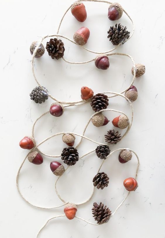 a pretty and very easy fall to Thanksgiving garland of pinecones and faux acorns is an ultimate solution for the pumpkin season