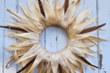 a simple corn husk wreath with a bit of feathers will give your outdoor space not just a rustic but also a boho look