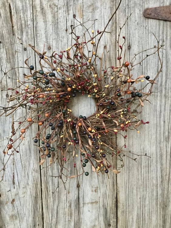a twig and pip berry wreath is a natural and chic decoration for the fall