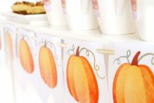 a vintage printable Thanksgiving banner with pumpkins is a fast and cool last-minute decor idea