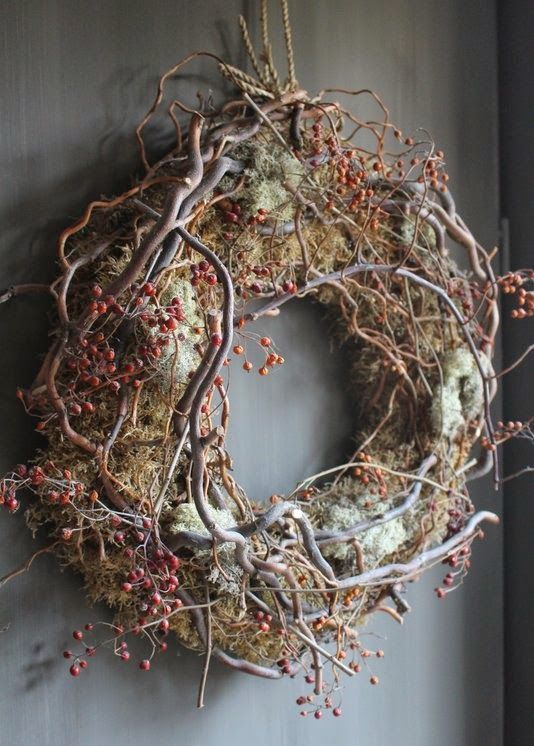a woodland vien and twig fall wreath with moss and berries looks very forest-like and inspires