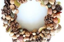 an organic fall wreath with pinecones, nuts, acorns, leaves is a cool and natural decor idea for this fall