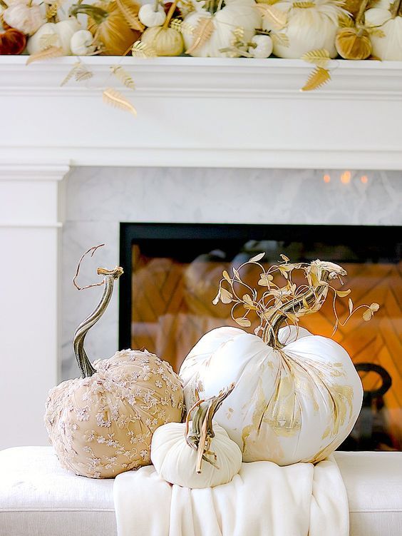 elegant and chic pumpkins with printing and embellishments, with stems and dried leaves for a refined arrangement