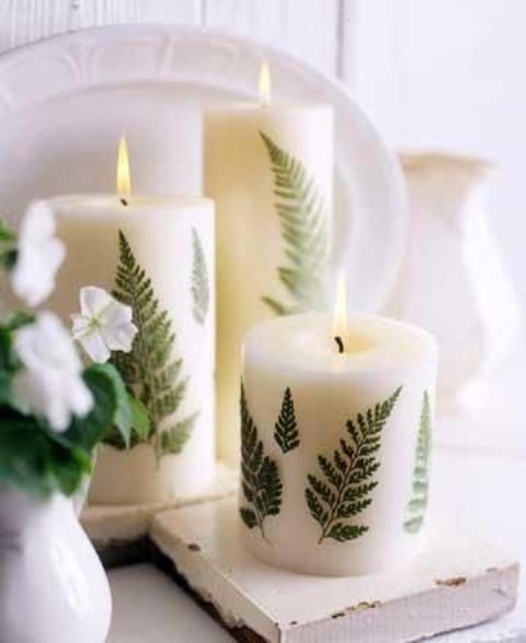 pillar candles with fern leaves attached add a woodland feel to your space and can be used not only in the fall but also in other seasons
