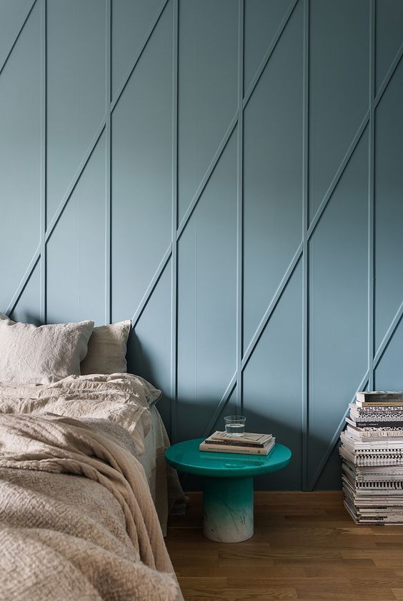 a fresh take on traditional - geometric blue molding on the wall to give it a pattern and a more eye-catchy look