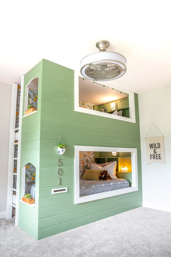 a modern farmhouse kids' room with a green house-shaped built-in bunk bed, a ladder, numbers and potted plants looks unusual and super eye-catchy