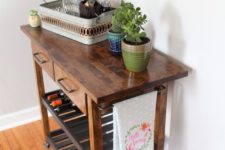 a rich stained IKEA Forhoja cart with a butcher block countertop becomes a mid-century modern home bar