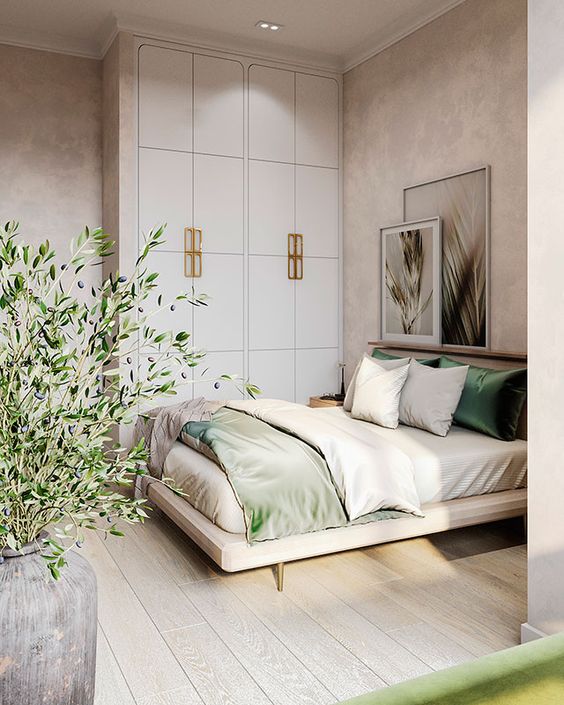 a small yet cozy bedroom looks bigger thanks to the neutral color scheme and a ledge with art over the bed
