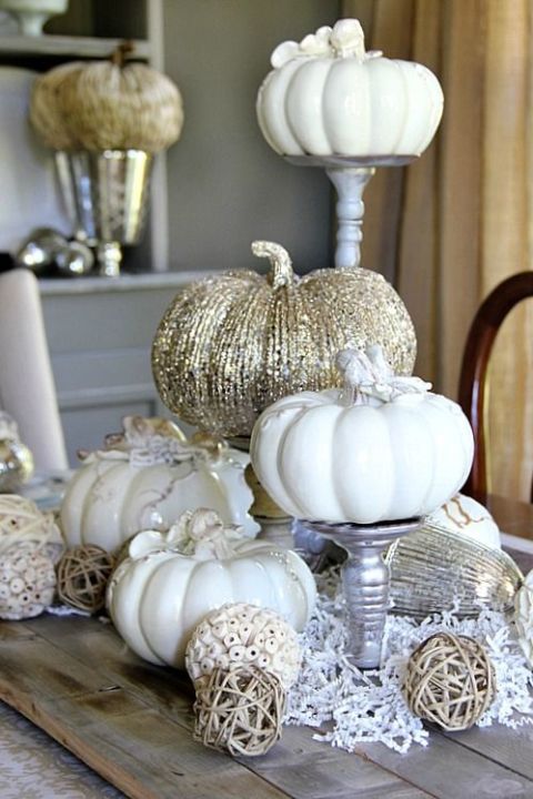 white and glitter pumpkins on metallic stands and with aux pumpkins under them for vintage glam decor
