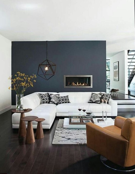 https://www.digsdigs.com/photos/2015/11/a-black-statement-wall-with-a-built-in-ethanol-fireplace-that-instantly-adds-coziness.jpg