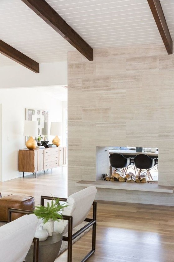 a gorgeous double-sided fireplace, which gives coziness to both the living room and dining space